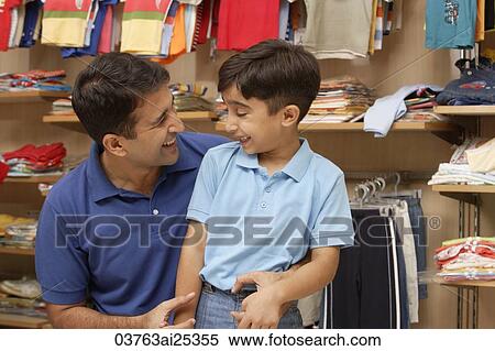 Stock Photography - father and son in shop. Fotosearch