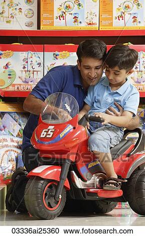 father and son in toy store View Large Photo Image Stock Image - father and son in toy store. Fotosearch