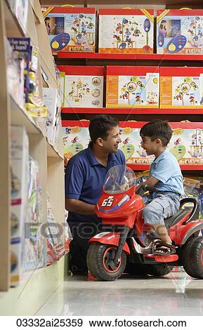 Stock Photo - father and son in toy store. Fotosearch