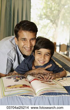 father and son reading book View Large Photo Image Picture - father and son reading book. Fotosearch