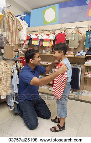father and son shopping for clothes View Large Photo Image Stock Photo - father and son shopping for clothes. Fotosearch