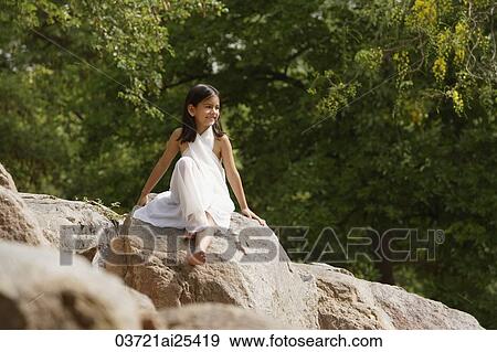 girl in white sari, sitting on rock View Large Photo Image Stock Photo - girl in white sari, sitting on rock. Fotosearch