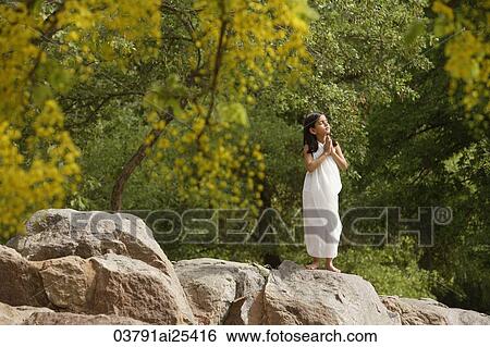 girl in white sari, standing in yoga pose on rock View Large Photo Image Stock Photograph - girl in white sari, standing in yoga pose on rock. Fotosearch
