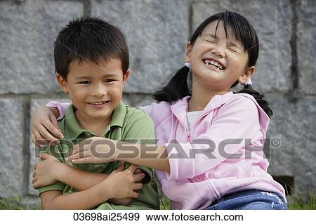 Girl with arms around boy View Large Photo Image Stock Photo - Girl with arms around boy. Fotosearch