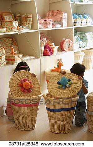 kids in shop looking in baskets View Large Photo Image Stock Photography - kids in shop looking in baskets. Fotosearch