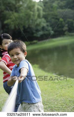 kids playing tug-o-war View Large Photo Image Stock Image - kids playing tug-o-war. Fotosearch
