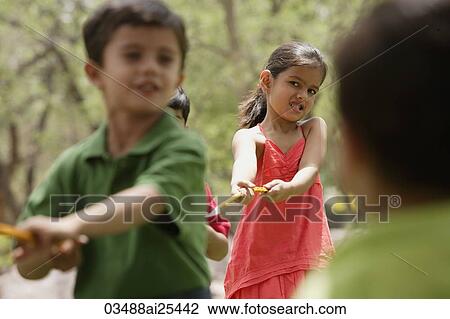 kids playing tug-o-war View Large Photo Image Stock Image - kids playing tug-o-war. Fotosearch