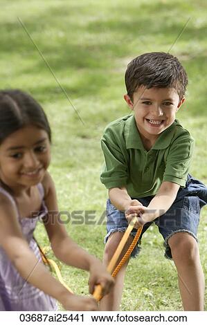 kids playing tug-o-war View Large Photo Image Stock Image - kids playing tug-o-war. Fotosearch