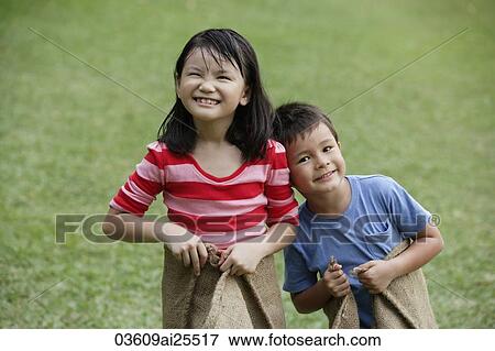 Stock Photo - Kids ready for a sack race. Fotosearch