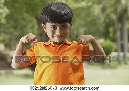 little boy flexing muscles View Large Photo Image Stock Image - little boy flexing muscles. Fotosearch