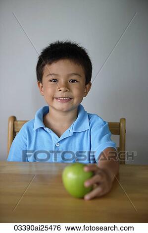 Little boy holding green apple View Large Photo Image Stock Photograph - Little boy holding green apple. Fotosearch