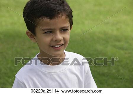 Little boy in white tee shirt, at park View Large Photo Image Picture - Little boy in white tee shirt, at park. Fotosearch