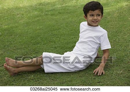 Stock Photography - little boy wearing all white. Fotosearch