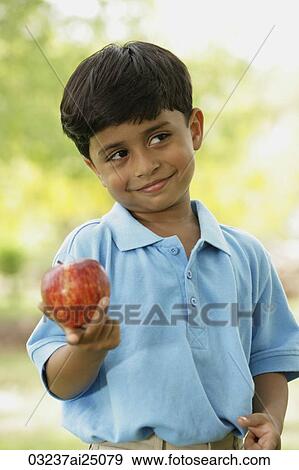 little boy with apple View Large Photo Image Stock Photo - little boy with apple. Fotosearch