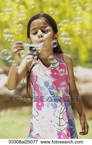 little girl blowing bubbles View Large Photo Image Stock Photo - little girl blowing bubbles. Fotosearch