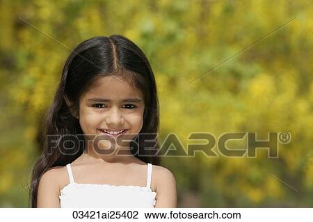 Stock Image - little girl in a park. Fotosearch