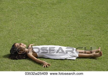 Stock Photo - little girl in park. Fotosearch
