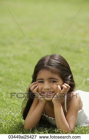 Stock Photo - little girl on grass. Fotosearch
