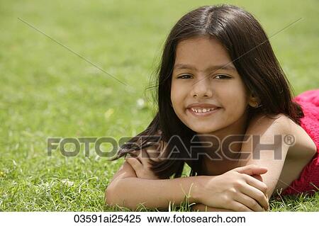 little girl on grass View Large Photo Image Stock Photography - little girl on grass. Fotosearch