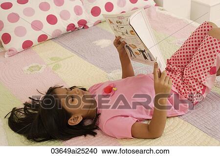 little girl reading on bed View Large Photo Image Stock Image - little girl reading on bed. Fotosearch