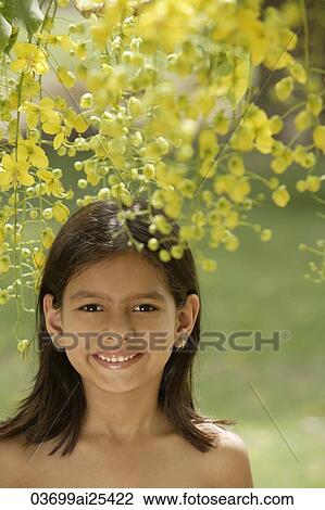 little girl under flowering tree View Large Photo Image Stock Image - little girl under flowering tree. Fotosearch