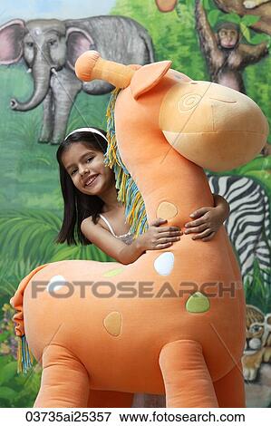little girl with big stuffed giraffe View Large Photo Image Stock Photo - little girl with big stuffed giraffe. Fotosearch