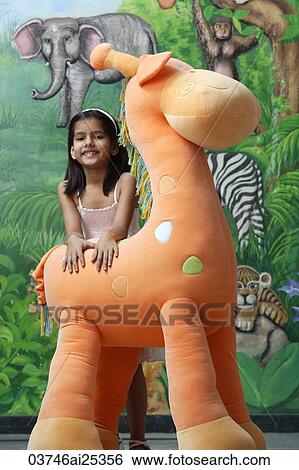 little girl with big stuffed giraffe View Large Photo Image Stock Photograph - little girl with big stuffed giraffe. Fotosearch