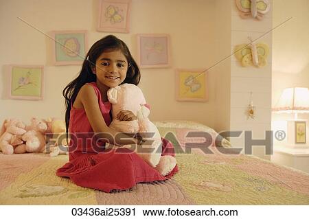little girl with stuff bear on bed View Large Photo Image Stock Image - little girl with stuff bear on bed. Fotosearch
