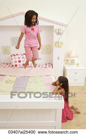 Little girls at play in their bedroom View Large Photo Image Stock Image - Little girls at play in their bedroom. Fotosearch