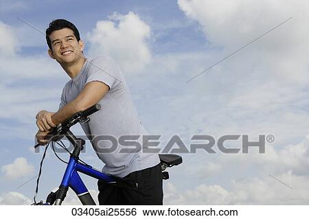 Stock Photograph - Man on bicycle. Fotosearch
