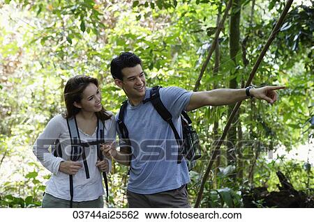 man pointing something out to woman View Large Photo Image Stock Image - man pointing something out to woman. Fotosearch