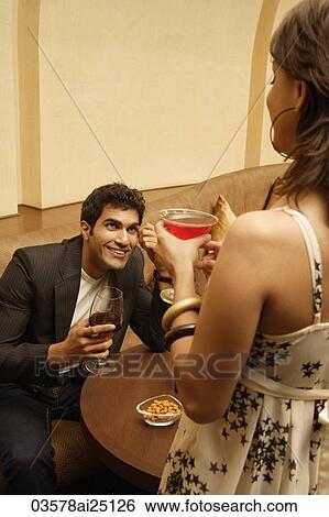 Stock Photograph - Man smiling up at woman. Fotosearch