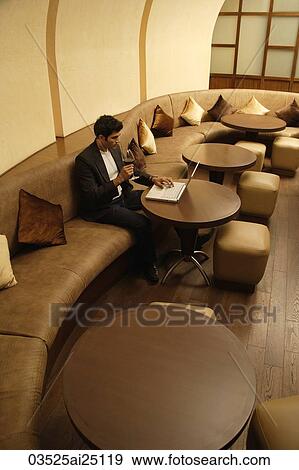 Stock Photo - man working on laptop. Fotosearch