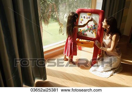 mother and daughter at easel View Large Photo Image Stock Image - mother and daughter at easel. Fotosearch