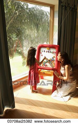 mother and daughter at easel View Large Photo Image Stock Image - mother and daughter at easel. Fotosearch