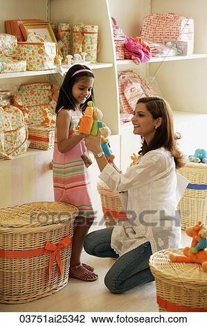mother and daughter in toy store View Large Photo Image Stock Image - mother and daughter in toy store. Fotosearch