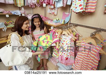mother and daughter shopping for clothes View Large Photo Image Stock Image - mother and daughter shopping for clothes. Fotosearch