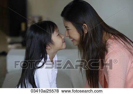 Mother and daughter touching noses View Large Photo Image Stock Photo - Mother and daughter touching noses. Fotosearch