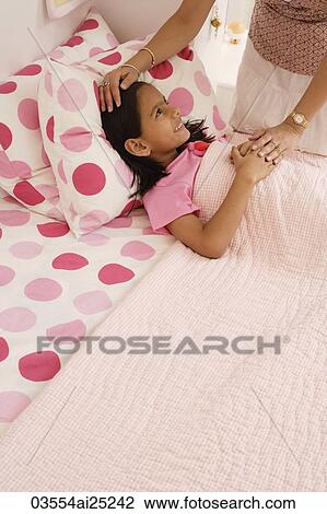 mother's hand on daughter's forehead View Large Photo Image Stock Image - mother's hand on daughter's forehead. Fotosearch