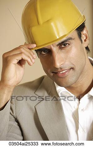 Stock Image - portrait of man in hard hat. Fotosearch