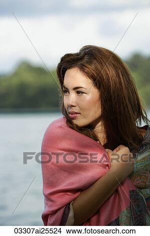 Profile of woman, wrapped in shawl View Large Photo Image Picture - Profile of woman, wrapped in shawl. Fotosearch