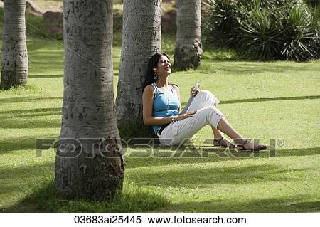 teen girl listening to music in park View Large Photo Image Stock Photography - teen girl listening to music in park. Fotosearch