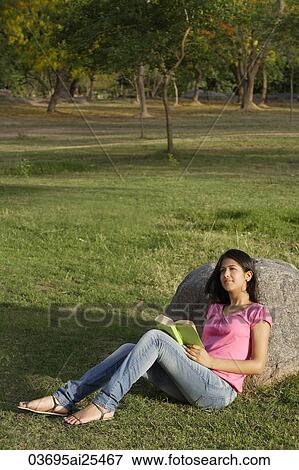 teen girl reading book in park View Large Photo Image Stock Photo - teen girl reading book in park. Fotosearch