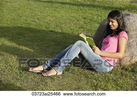 teen girl reading book in park View Large Photo Image Stock Photograph - teen girl reading book in park. Fotosearch