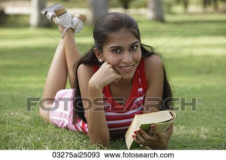 Teen girl with book in the park View Large Photo Image Stock Image - Teen girl with book in the park. Fotosearch