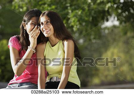 Teen girls sharing secret View Large Photo Image Stock Image - Teen girls sharing secret. Fotosearch