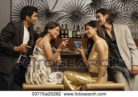 two couples in a bar View Large Photo Image Stock Image - two couples in a bar. Fotosearch
