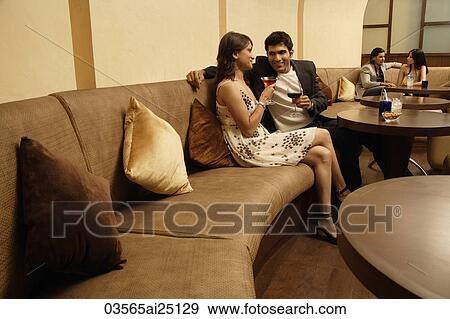 Stock Photo - two couples in restaurant. Fotosearch