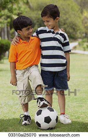 Stock Image - two little boys with soccer ball. Fotosearch