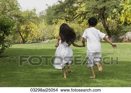two little children running away View Large Photo Image Picture - two little children running away. Fotosearch